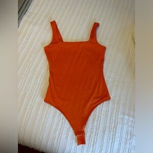 Orange seamless bodysuit